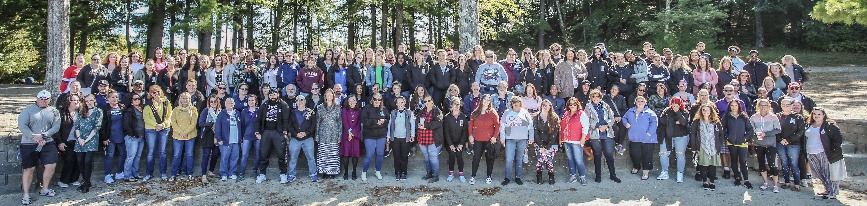 A large group of LUK staff outdoors at a Staff Appreciation day 