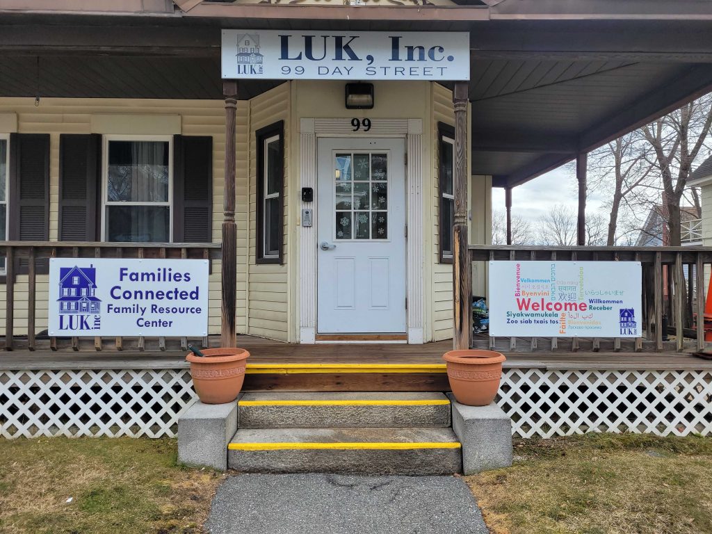 The outside of the LUK Families Connected Family Resource Center, which shows a sign with "Welcome" in many languages